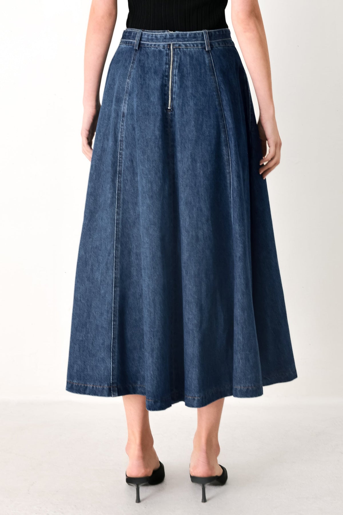 Flying Tomato Sweet Talker denim circle midi skirt in indigo, showing the high-waisted, A-line silhouette with front button details.