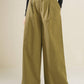 Olive green woven pants from Flying Tomato's Hidden Reflections collection, showcasing relaxed fit and textured fabric.