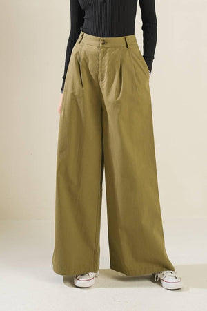 Olive green woven pants from Flying Tomato's Hidden Reflections collection, showcasing relaxed fit and textured fabric.