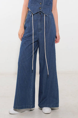 Flying Tomato I Still Believe denim pants in medium indigo color, showing the relaxed fit and classic jean style.