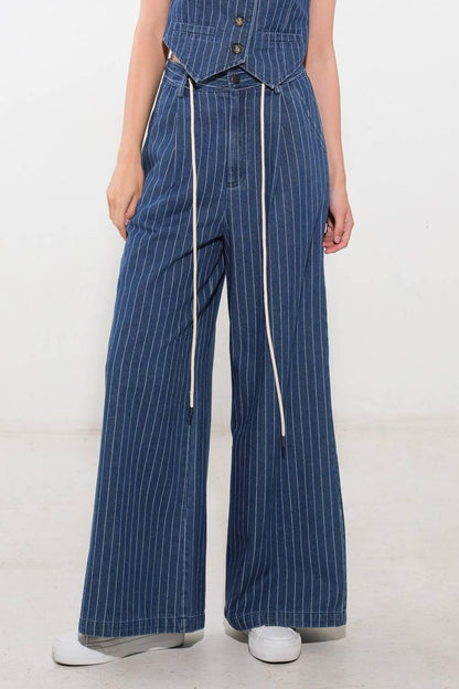 Flying Tomato I Still Believe denim pants in medium indigo color, showing the relaxed fit and classic jean style.
