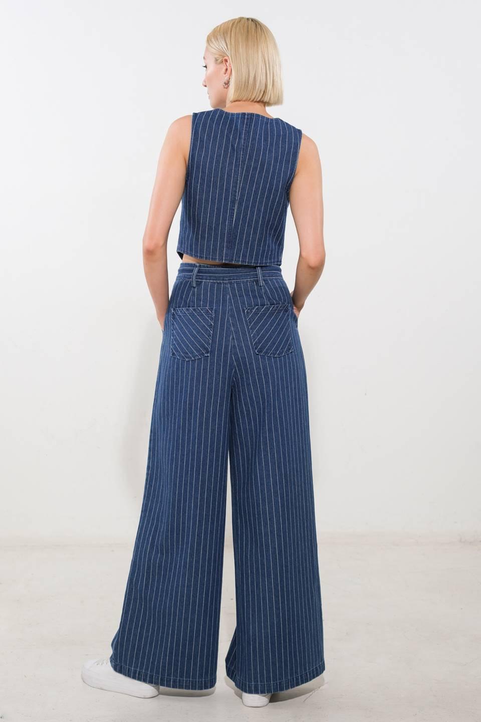 Flying Tomato I Still Believe denim pants in medium indigo color, showcasing relaxed fit and classic jean style.