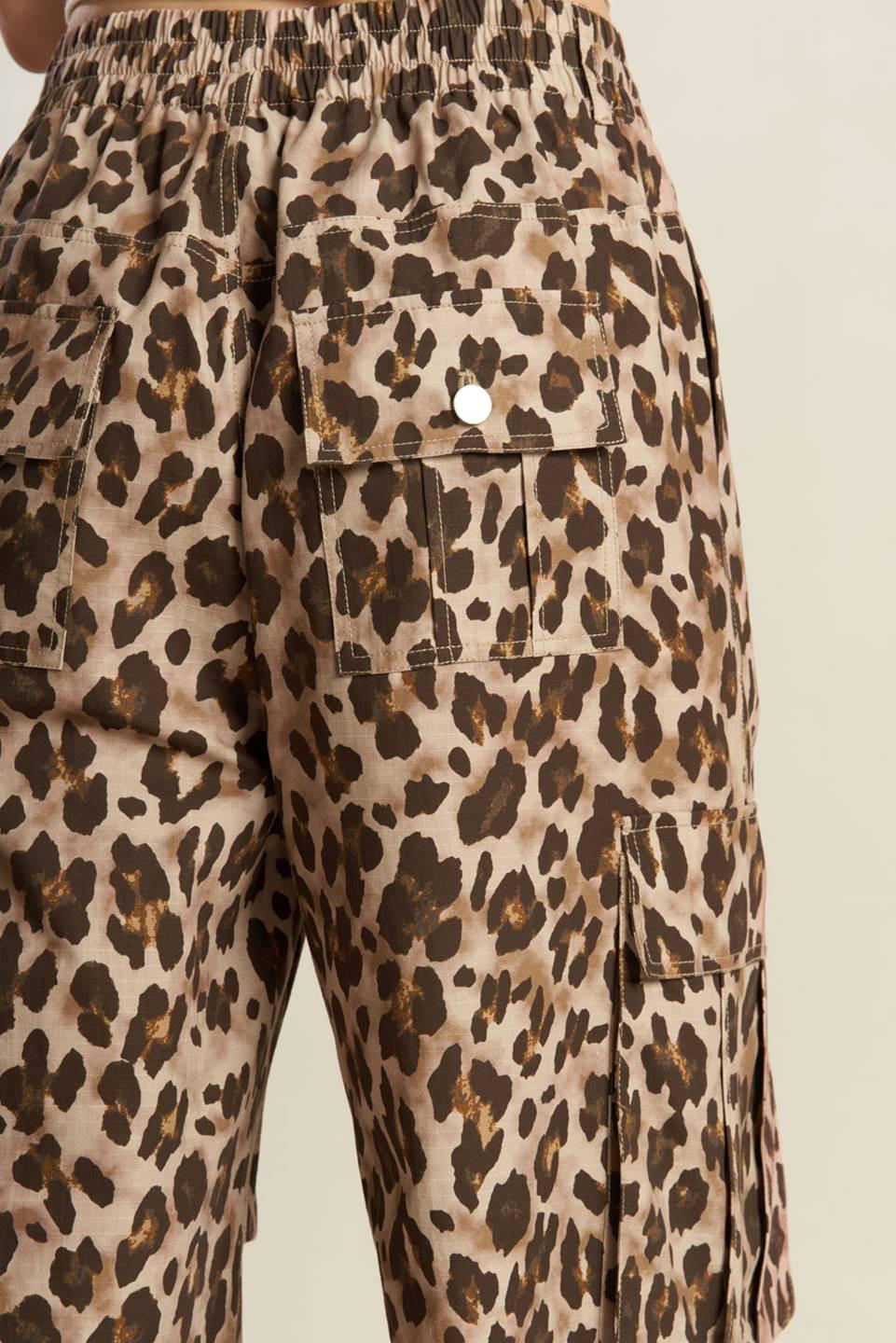 Taupe brown woven pants by Flying Tomato, featuring a relaxed fit and detailed stitching, perfect for casual wear.
