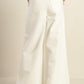 White woven pants by Flying Tomato featuring a delicate hue and relaxed fit, shown on a model.