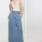 Light denim Flying Tomato Kissed by Sunlight denim pants shown on a hanger with a close-up of fabric texture.