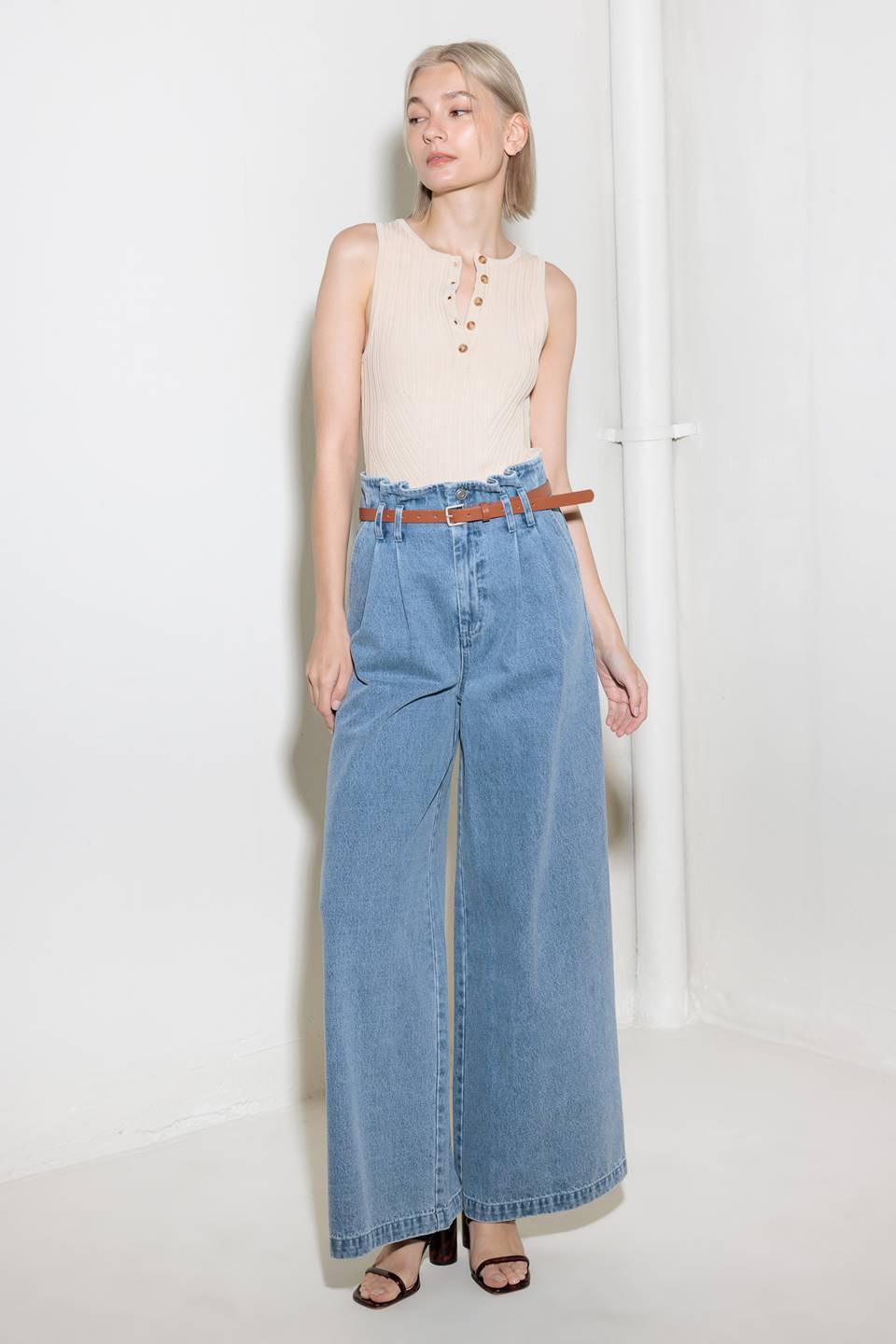 Light denim Flying Tomato Kissed by Sunlight denim pants, showcasing classic fit and stylish stitching on the front.