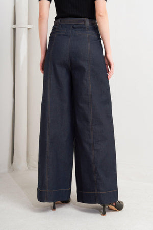 Dark denim Urban Panel pants by Flying Tomato, with a slim fit design and five-pocket style, shown on a model.