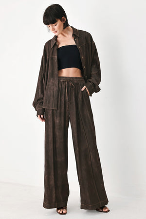 Dark brown Flying Tomato Sable Lounge Woven Pants laid flat, showcasing comfortable relaxed fit and woven fabric design.