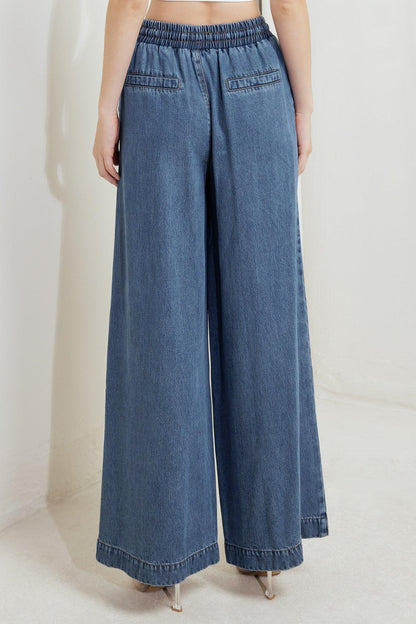 Flying Tomato offline edge indigo denim pants shown on a model, featuring classic five-pocket style and straight-leg fit.