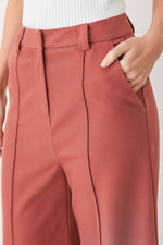 Flying Tomato Modern Flow Woven Pants in dried rose color, showcasing lightweight, relaxed-fit pants with a woven texture.