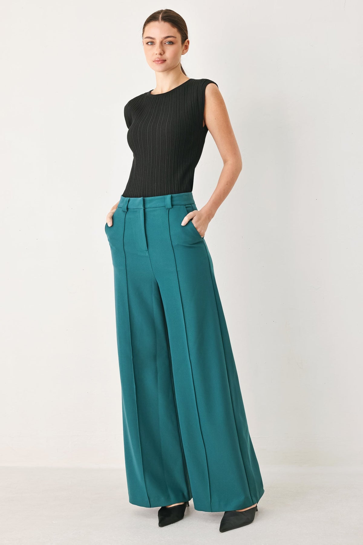 Flying Tomato Modern Flow woven teal pants with a relaxed fit and stylish design, shown on a model.
