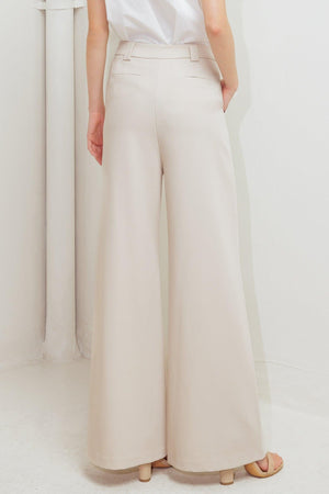 Flying Tomato Monday Flow Woven Pants in light beige, featuring a relaxed fit and woven fabric, displayed on a neutral background.