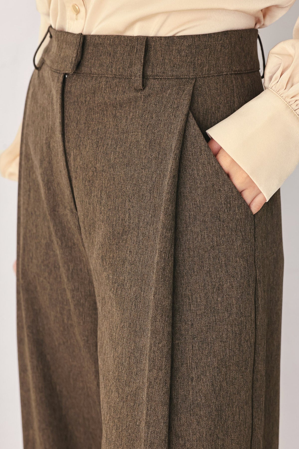 Flying Tomato Bistro Brown Woven Wide Leg Pants, showing the relaxed fit and textured fabric in a natural standing pose.