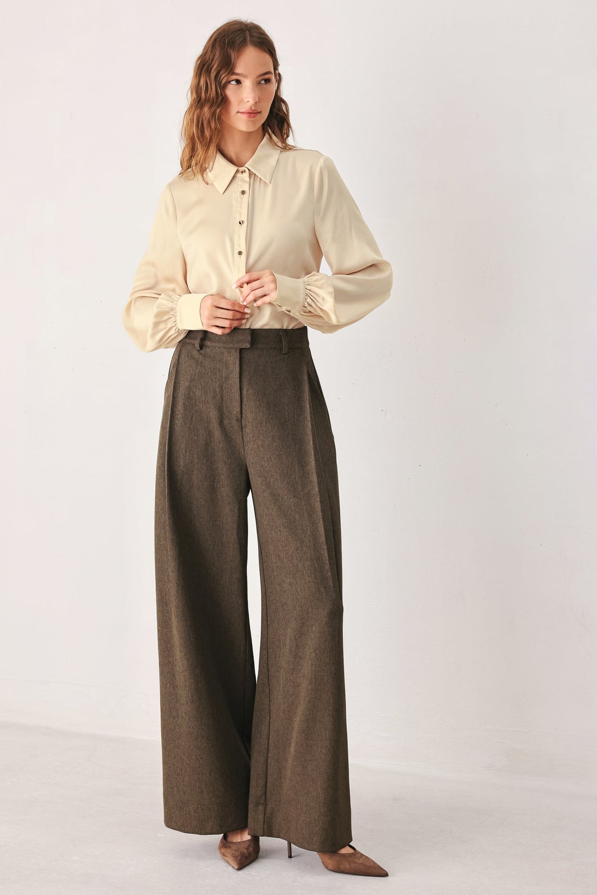 Flying Tomato Bistro Brown Woven Wide Leg Pants shown with relaxed fit, high waist, and wide-leg design in a warm brown color.