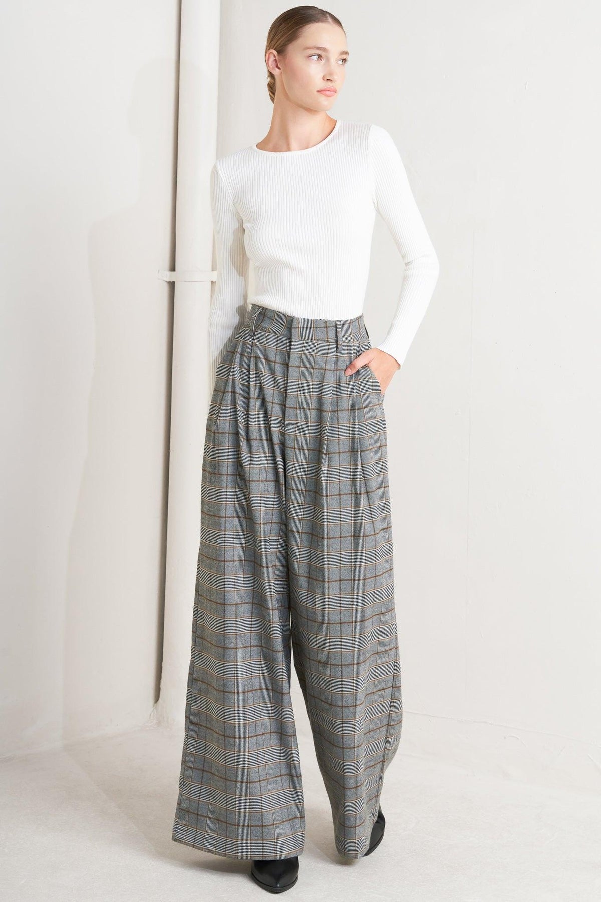 Flying Tomato woven plaid pants in brown and black, featuring a relaxed fit and stylish woven fabric.