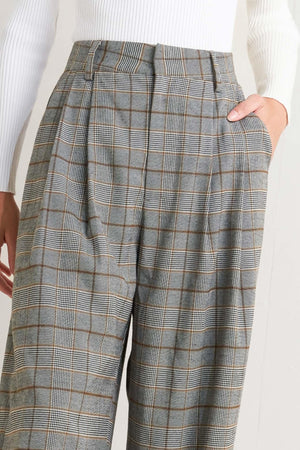 Flying Tomato woven plaid pants in brown and black, featuring a comfortable fit and stylish pattern.