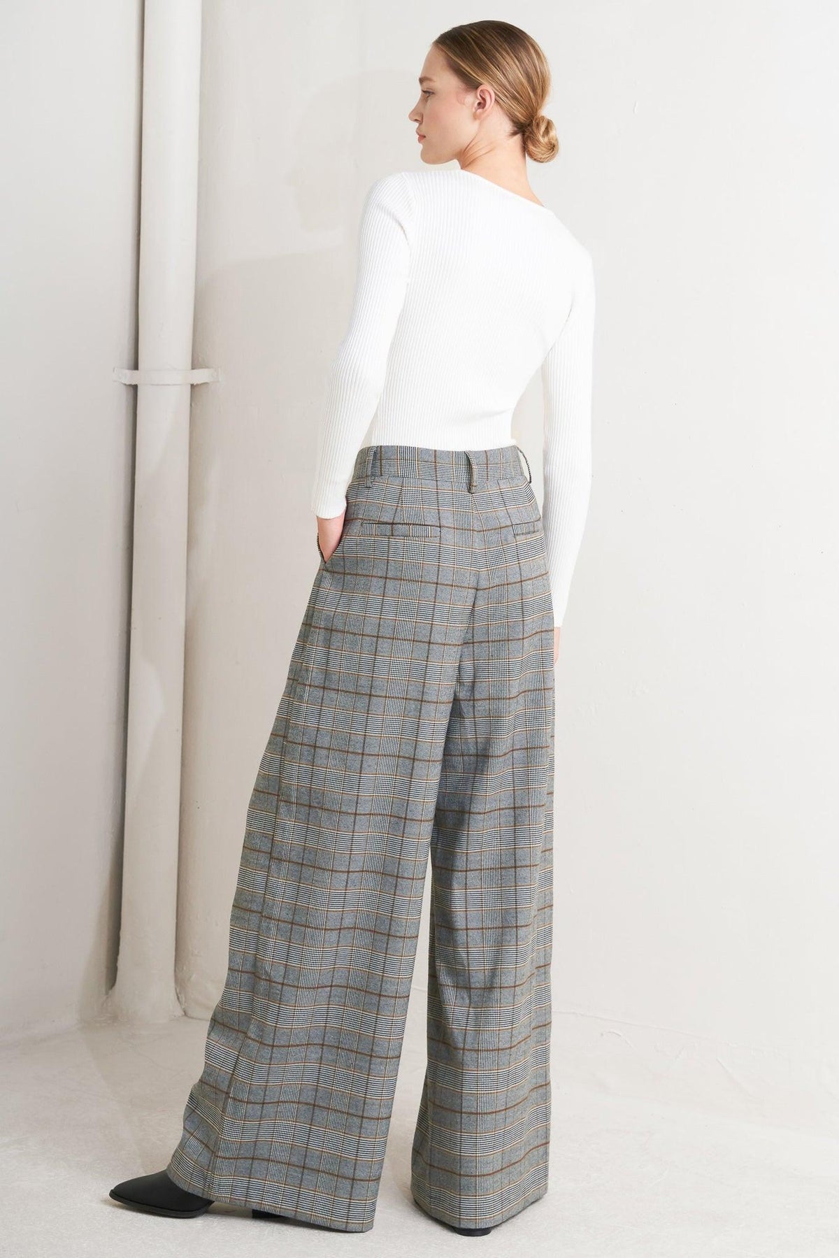 Flying Tomato woven plaid pants in brown and black, featuring a stylish, comfortable design with a classic plaid pattern.
