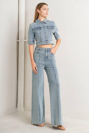 Light wash modern neutral denim pants by Flying Tomato, showing relaxed fit and classic five-pocket style.