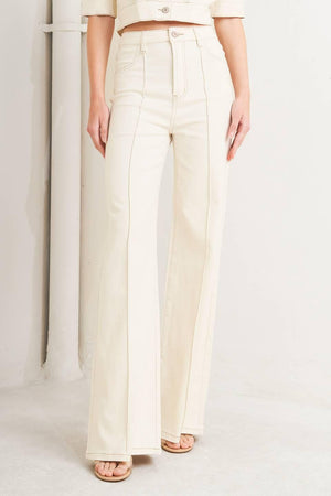 Light beige Flying Tomato modern neutral twill pants with a relaxed fit and classic waistband, displayed on a hanger.