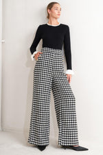 Flying Tomato Metro Icon woven houndstooth pants in black and white, featuring a classic pattern and tailored fit.