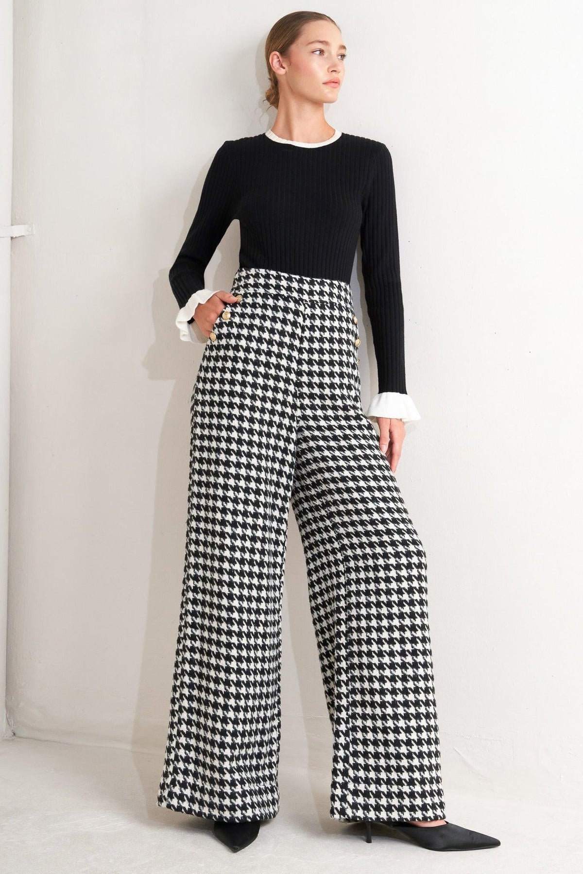 Flying Tomato Metro Icon woven houndstooth pants in black and white, featuring a classic pattern and tailored fit.