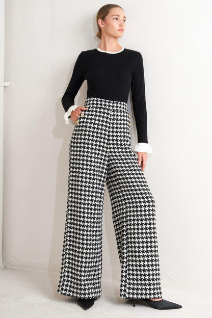 Flying Tomato Metro Icon woven houndstooth pants in black and white, featuring a classic pattern and tailored fit.