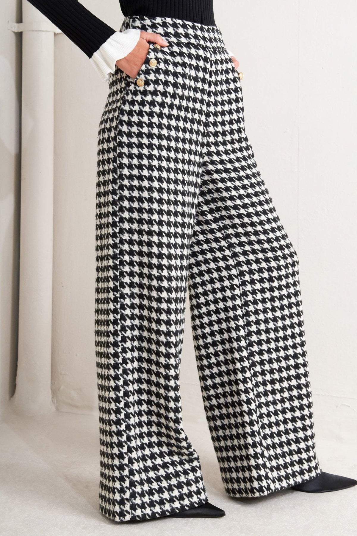 Flying Tomato Metro Icon woven houndstooth pants in black and white, featuring a classic pattern and tailored fit.