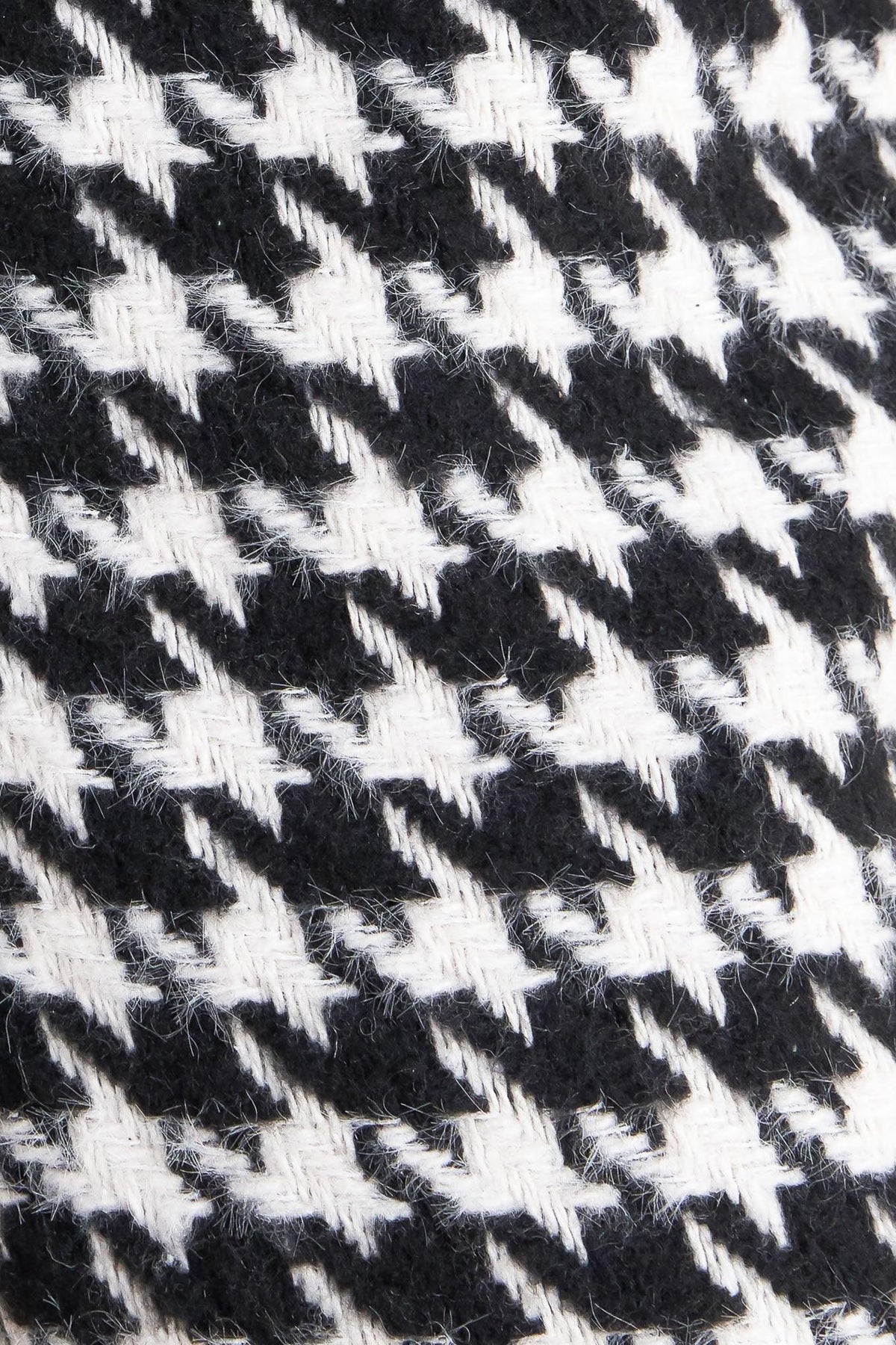 Flying Tomato Metro Icon woven houndstooth pants in black and white, showcasing stylish, tailored design with a classic pattern.