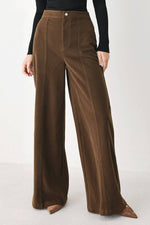 Flying Tomato Cocoa After Hours wide leg pants in brown, displayed on a hanger with a relaxed fit and flowy fabric.