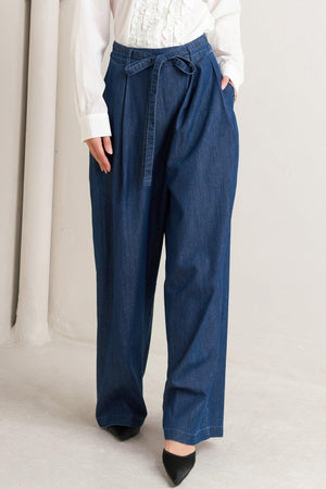 Flying Tomato relaxed tailored denim pants in indigo with a loose fit, shown on a model against a plain background.