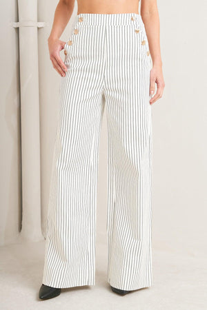 Flying Tomato Effortless Form Stripe Woven Pants in white with vertical stripes, showcasing a relaxed fit and woven fabric detail.