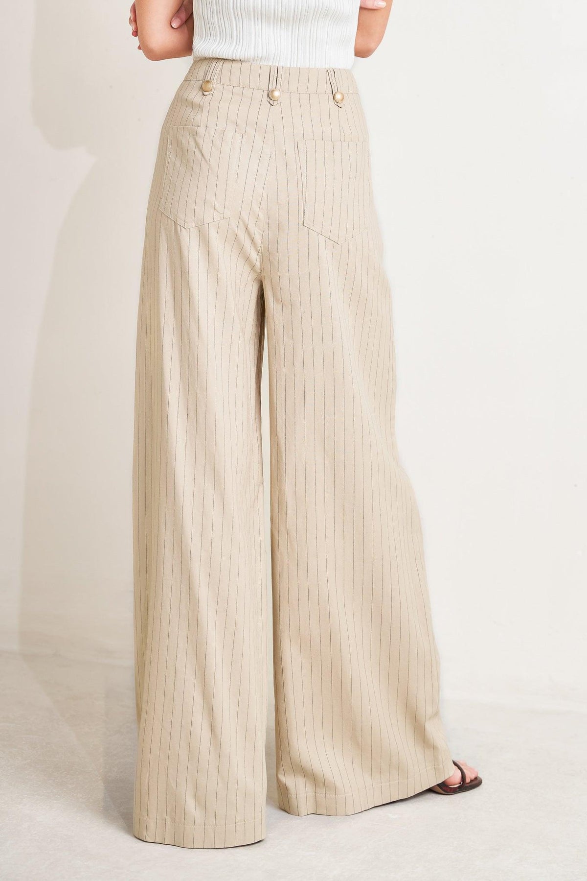 Flying Tomato woven pants in taupe and black, featuring a tailored design with a relaxed fit and subtle textured fabric.