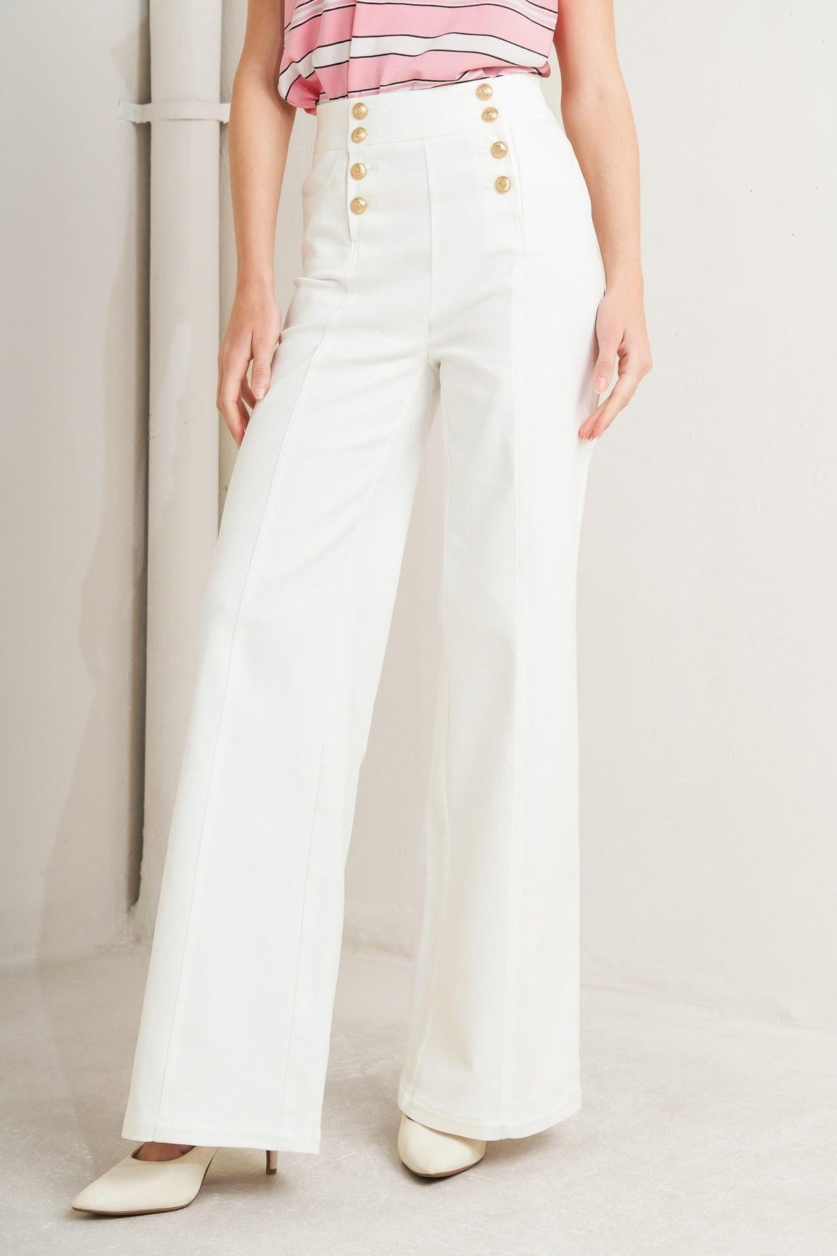 Flying Tomato Moon Deck woven pants in white, featuring a relaxed fit and woven fabric, styled on a model.