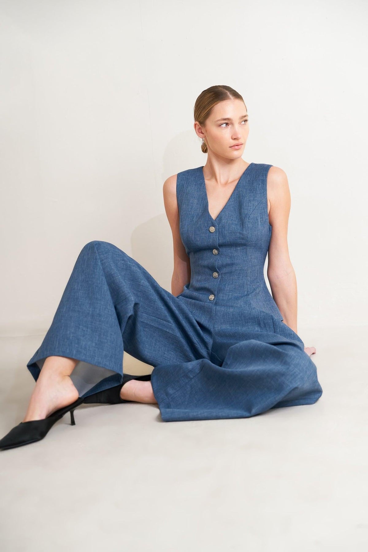 Flying Tomato Power Move woven pants in denim blue, showing the relaxed fit and textured woven fabric.