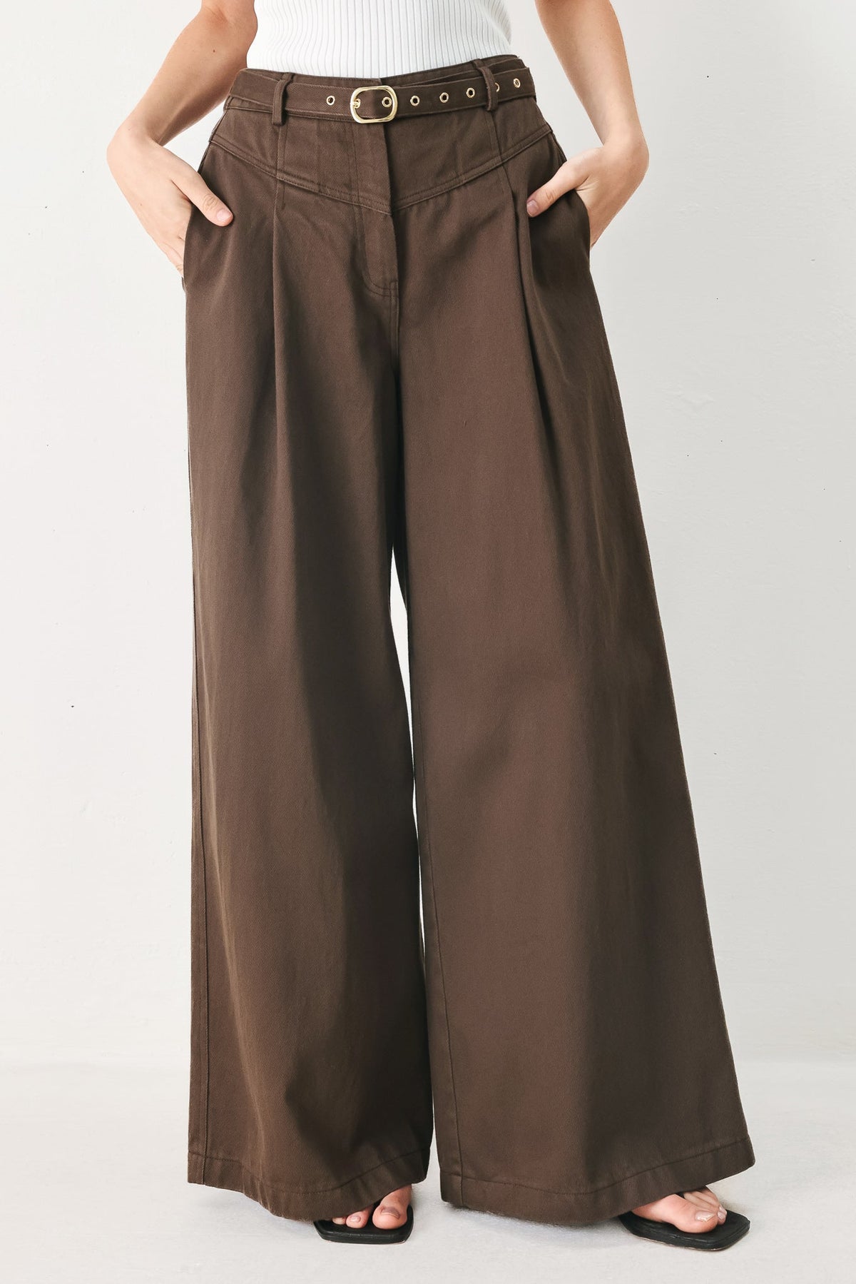 Brown Sugar woven pants by Flying Tomato featuring a stylish, textured woven fabric and a relaxed fit in a warm brown color.