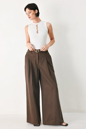 Flying Tomato brown woven pants featuring a statement design, with a relaxed fit and stylish texture.