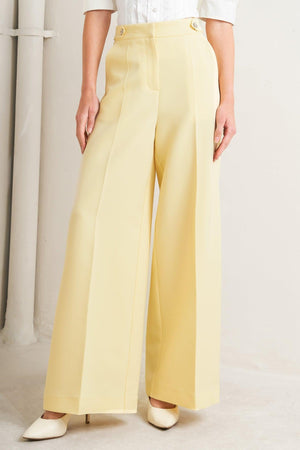 Flying Tomato Sunshine Dream woven pants in vibrant yellow, featuring a relaxed fit and colorful woven pattern.