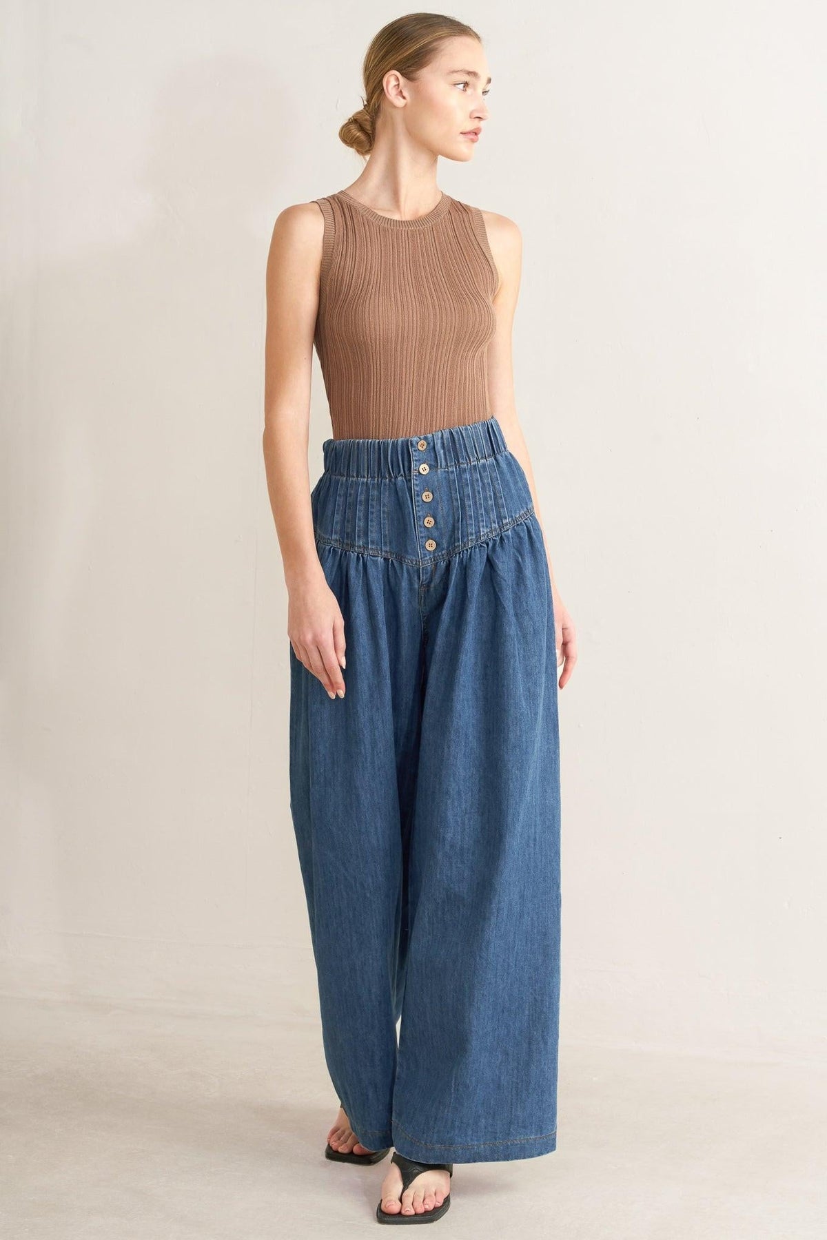 Flying Tomato Pacific Breeze denim pants in indigo, showing a close-up of the stylish, fitted jeans with pockets and belt loops.