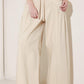 Light beige Flying Tomato Daylight Groove woven pants with a relaxed fit, featuring a textured woven fabric and casual waistband.