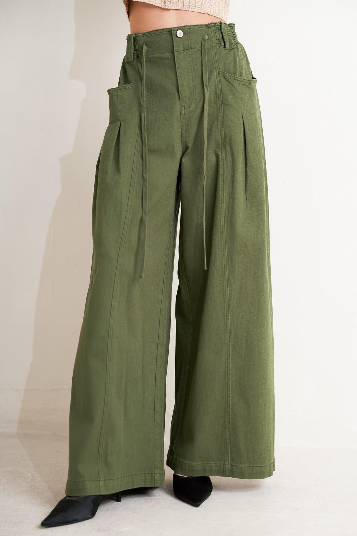 Flying Tomato daylight groove woven pants in olive green, featuring a relaxed fit and textured woven fabric.