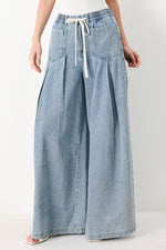 Flying Tomato Cloud Wash Palazzo Denim Pants in light denim with wide-leg style and relaxed fit.