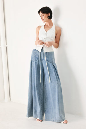Flying Tomato Cloud Wash Palazzo Denim Pants in light denim with relaxed fit and wide-leg design, shown on a model.