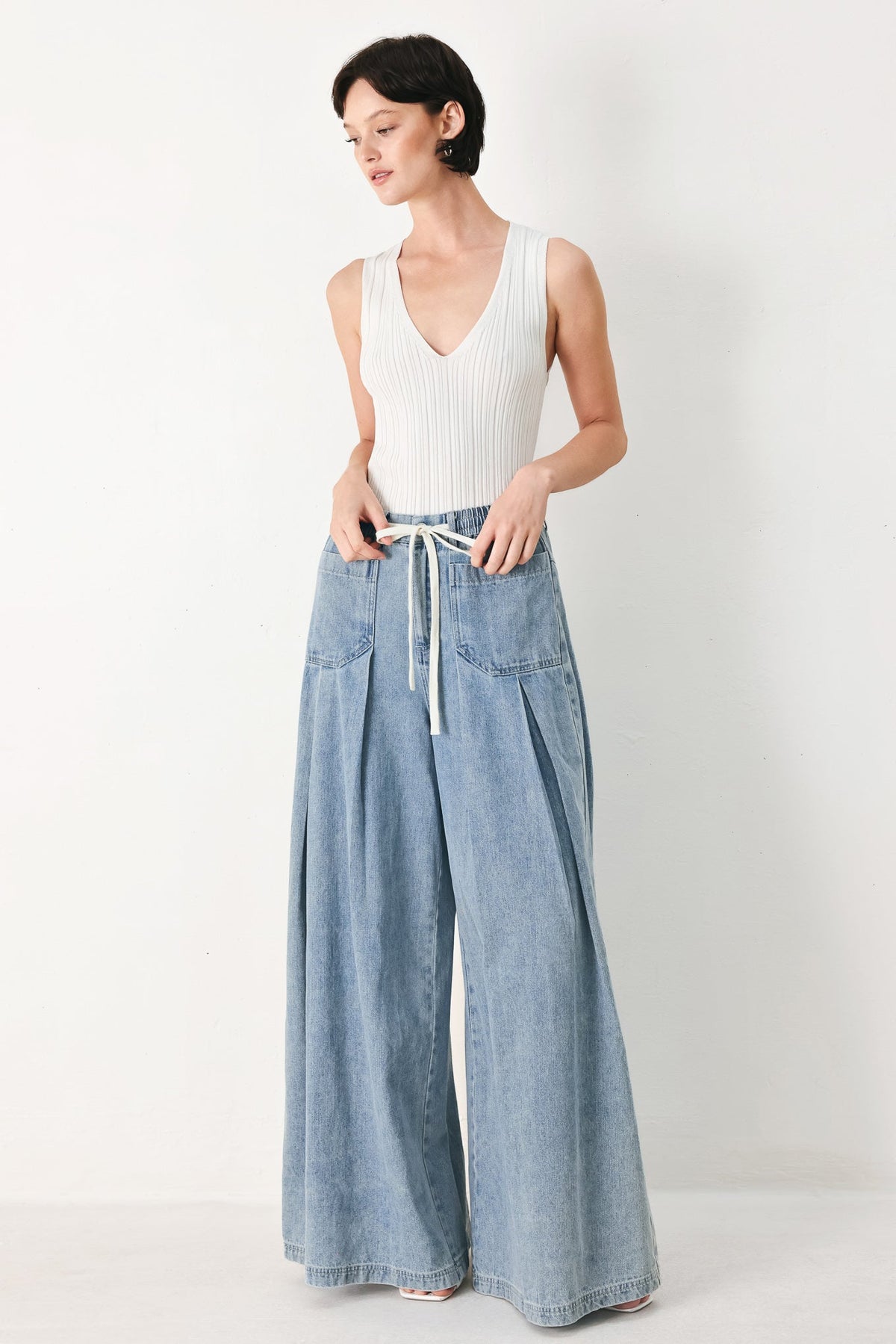 Flying Tomato Cloud Wash Palazzo Denim Pants in light denim, featuring a relaxed fit with wide legs and trendy style.