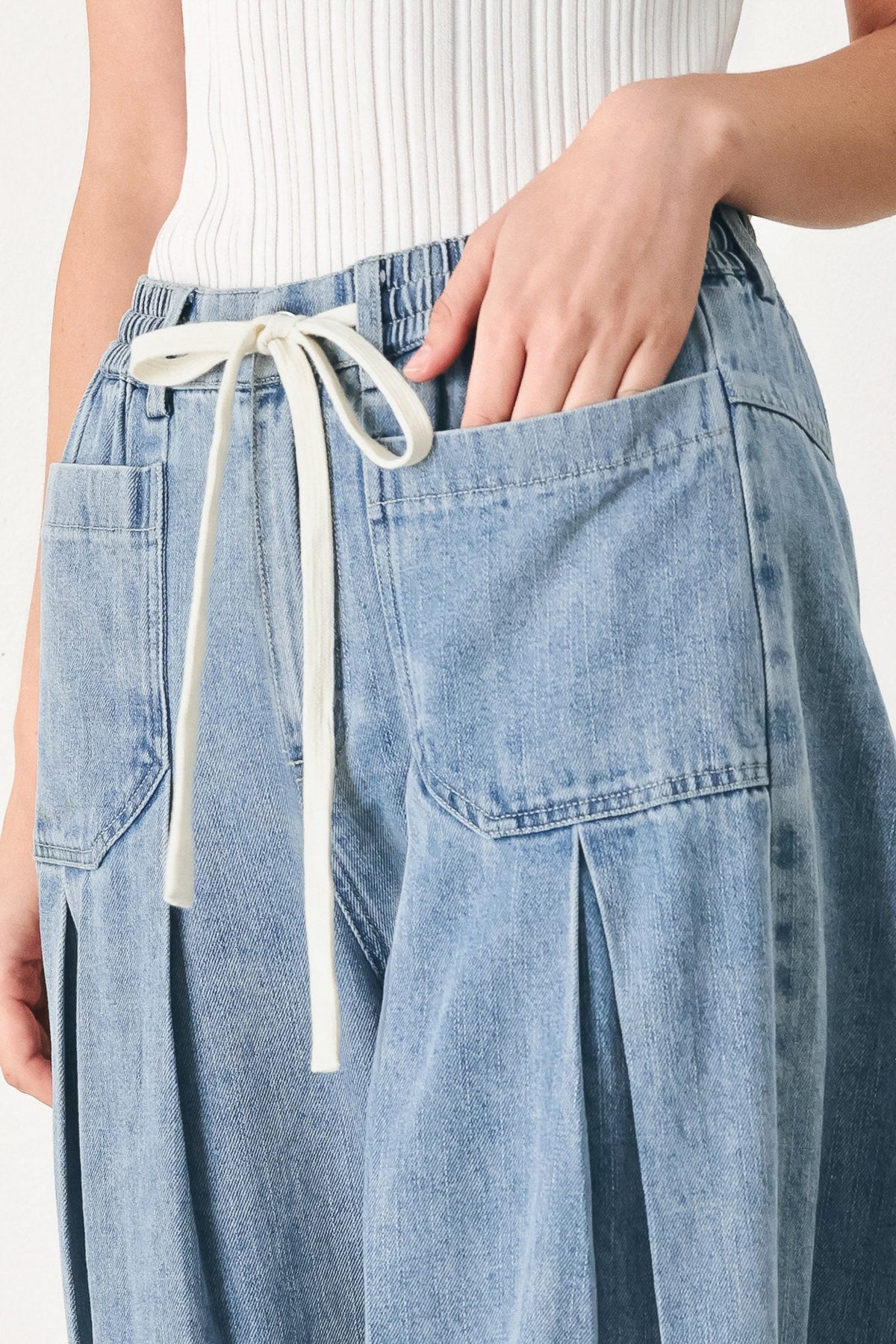 Light denim Flying Tomato Cloud Wash Palazzo pants with relaxed fit and wide-leg style, displayed on a mannequin.