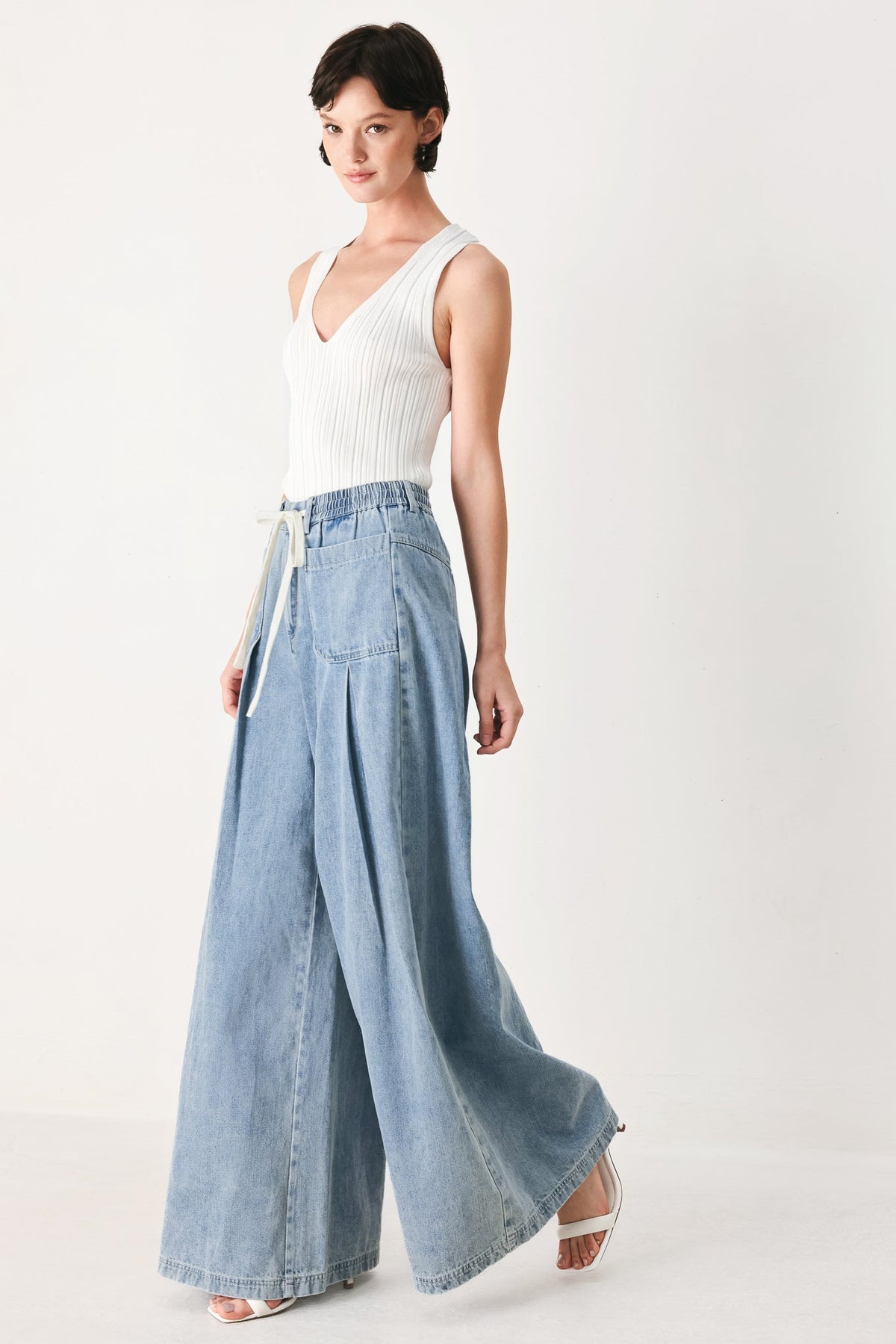 Flying Tomato Cloud Wash Palazzo Denim Pants in light denim with a relaxed fit and wide-leg style.