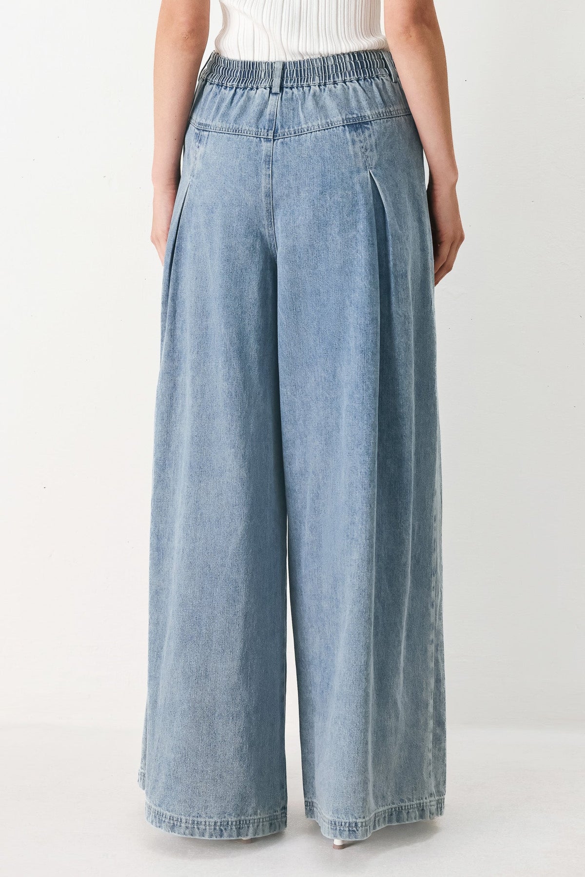 Flying Tomato Cloud Wash Palazzo Denim Pants in light denim, featuring a relaxed fit and wide-leg style.