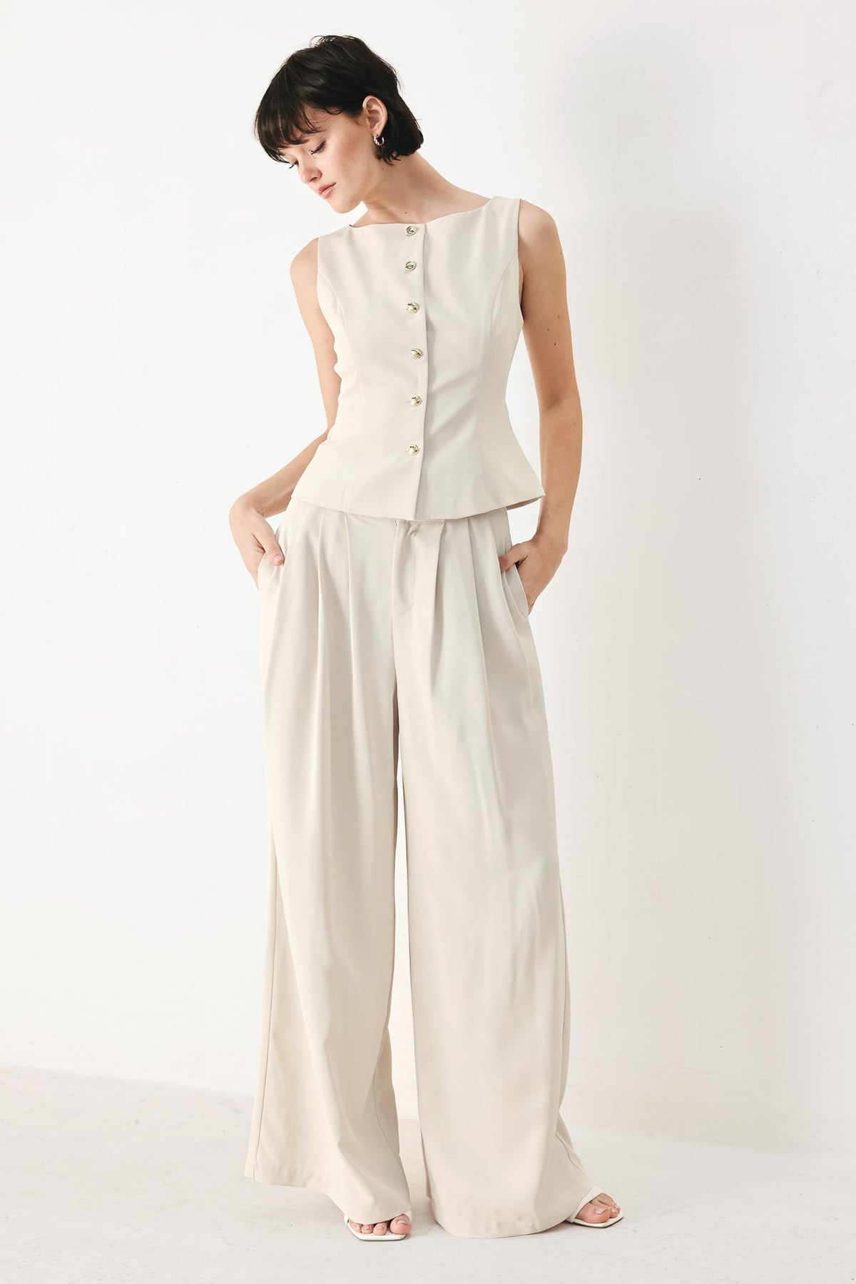 Flying Tomato modern minimal woven pants in neutral color with a relaxed fit and subtle textured fabric.