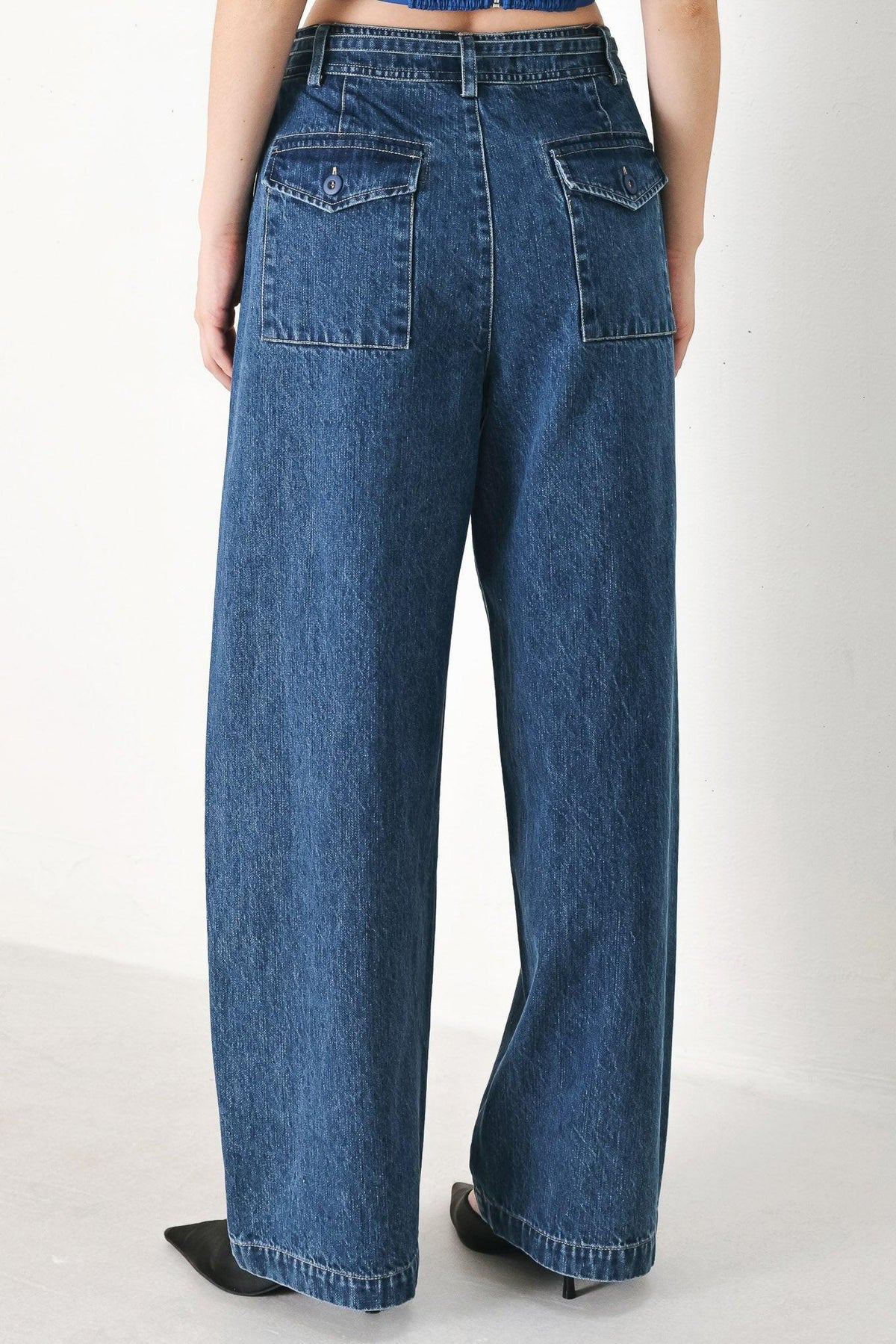 Flying Tomato blue honey oversized denim pants with relaxed fit and indigo wash, visible front and back pockets, casual style.