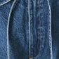 Flying Tomato blue oversized denim pants with a relaxed fit, shown in indigo color with stylish stitching and pockets.