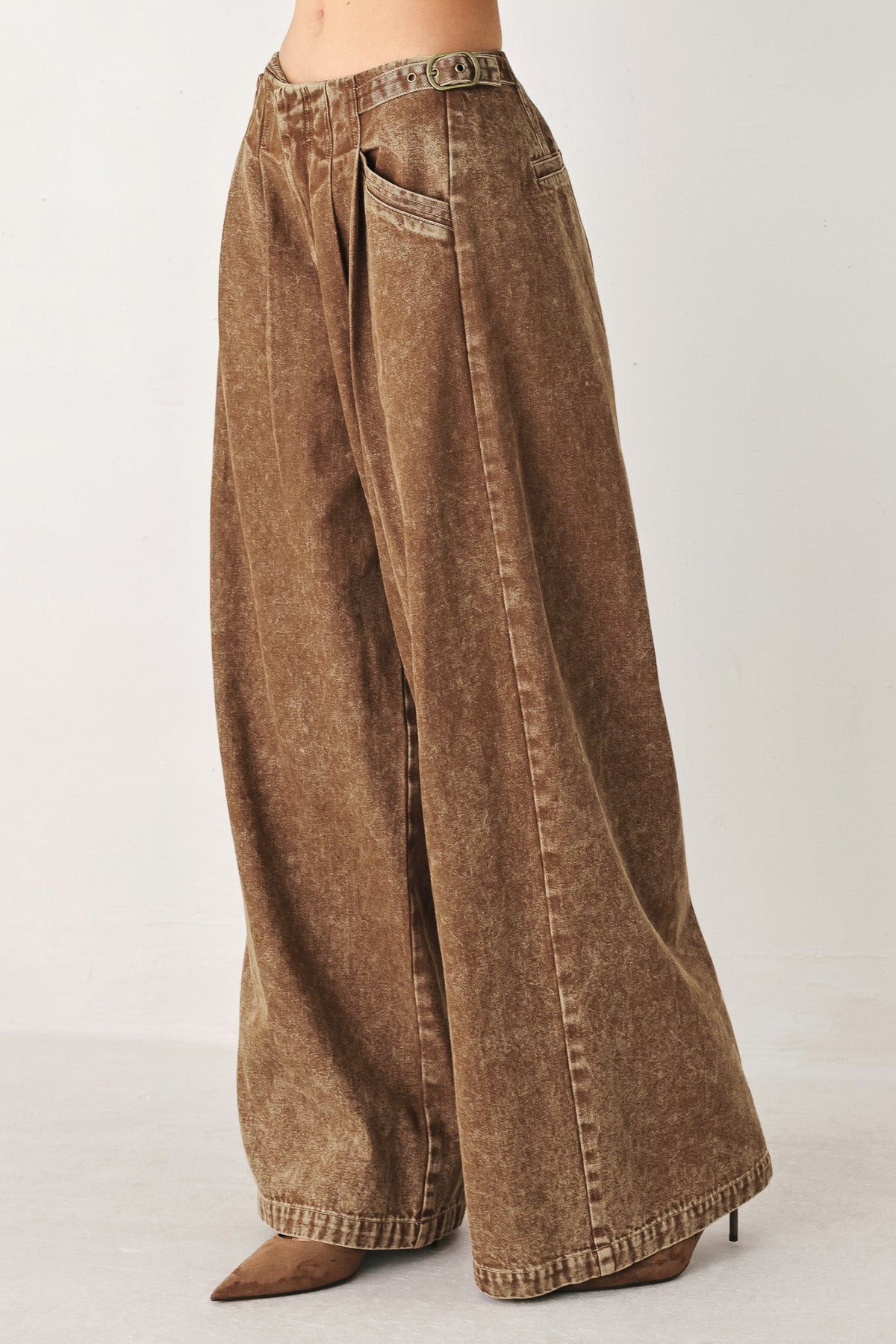 Vintage brown denim pants from Flying Tomato, showing the classic fit and detailed stitching on the front.